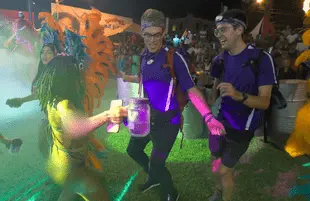 Remember dancing? Amazing Race contestants Will Jardell and James Wallington take in carnival in Trinidad in the season opener. (Photo: CBS) 