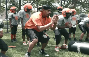 Coach Gawuala with the 9U team in We Are: The Brooklyn Saints. (Photo: NETFLIX)
