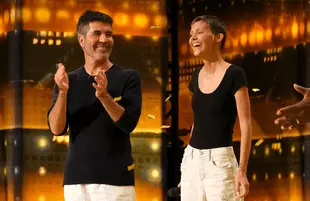 Simon Cowell and his Golden Buzzer contestant, Nightbirde. (Photo: NBC)