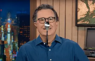 "Oh my god! It's the dreaded Thanksgiving kids' table syndrome!" joked Colbert. (Photo: CBS)