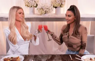 Kim Kardashian an oasis of normalcy and competence? As Paris Hilton's guest on Cooking With Paris, she is. (Photo: Kit Karzen/Netflix)