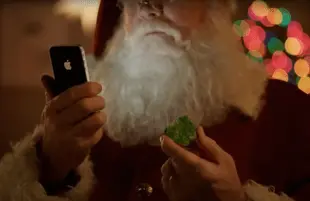 Santa uses Siri in a 2011 Apple ad (Photo: YouTube)