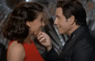 John Travolta and Idina Menzel at the Oscars, the year after he invoked Adele Dazeem
