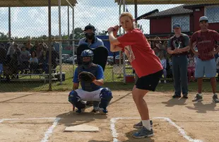 Elle Fanning's Michelle Carter has the first at-bat in The Girl From Plainville's ridiculous baseball scene. (Photo: Hulu)