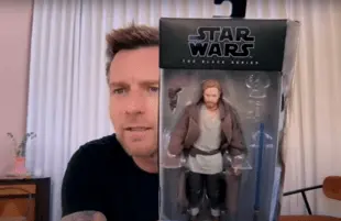 Ewan McGregor with his Obi-Wan Kenobi doll (Photo: ABC/YouTube)