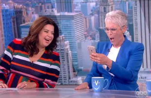 Jamie Lee Curtis reacts in mock horror to something on Ana Navarro's phone. (Photo: ABC)
