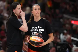 Caitlin Clark of the Indiana Fever talks with Sabrina Ionescu of the New York Liberty prior to the 2025 AT&T WNBA All-Star Game (Photo by Steph Chambers/Getty Images)