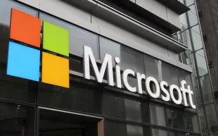 Microsoft logo at their office building (Image via Getty)