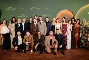 LOS ANGELES, CALIFORNIA - FEBRUARY 10: (L-R) Morgana O'Reilly, Natasha Rothwell, Julian Kostov, Carrie Coon, Mike White, Sam Nivola, Arnas Fedaravičius, Charlotte Le Bon, David Bernad, Nicholas Duvernay, Patrick Schwarzenegger, Jason Isaacs, Walton Goggins, Leslie Bibb, Tayme Thapthimthong, Lisa, Aimee Lou Wood, Sarah Catherine Hook, Parker Posey, Shalini Peiris and Lek Patravadi attend the Los Angeles Premiere of HBO Original Series "The White Lotus" Season 3 at Paramount Theatre on February 10, 2025 in Los Angeles, California. (Photo by Emma McIntyre/Getty Images)