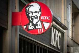 BRISTOL, UNITED KINGDOM - OCTOBER 18: The sun shines on the logo of Colonel Sanders, founder of the Kentucky Fried Chicken fast food restaurant KFC, (Photo by Matt Cardy/Getty Images).
