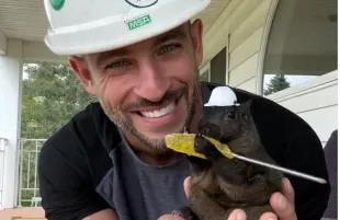 Mark Longo with Peanut the Squirrel (Image via Instagram/@peanut_the_squirrel12)