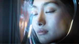  Mitsuki Yamato, played by Shioli Kutsuna, during the signal interface sequence in Invasion season 2. (Image via youtube/@Apple TV)