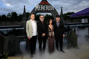 PARIS, FRANCE - JULY 31: (L-R) Miles Millar, Tim Burton, Jenna Ortega and Alfred Gough attend Le Beach Club de Mercredi (Wednesday's Beach Club) opening on July 31, 2025 in Paris, France. (Photo by Kristy Sparow/Getty Images)