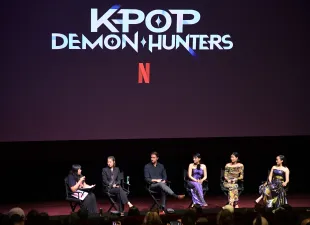 LOS ANGELES, CALIFORNIA - JUNE 16: (L-R) Moderator Laura Sirikul with Maggie Kang, Chris Appelhans, Arden Cho, May Hong and Ji-young Yoo speak during the KPop Demon Hunters Special Screening Q&A at Netflix Tudum Theater on June 16, 2025 in Los Angeles, California.  (Photo by Charley Gallay/Getty Images for Netflix)
