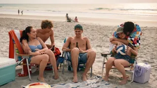 Friends relax on Cousins Beach during wedding week in The Summer I Turned Pretty Season 3. Image: Prime Video.