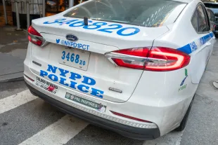 NYPD officer started trending after he was seemingly spotted checking out a female (Image via Getty)