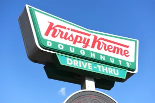 Krispy Kreme Doughnuts store sign (Photo by Peter Dazeley/Getty Images)