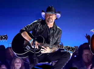 Jason Aldean was joined by a cancer patient on stage who has been battling the disease since 2018 (Image via Getty)