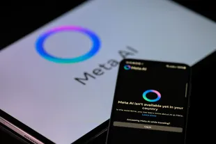 The Meta AI app is displayed on a mobile phone with the Meta AI logo visible on a tablet in this photo illustration in Brussels, Belgium, on January 26, 2025. (Photo by Jonathan Raa/NurPhoto via Getty Images)