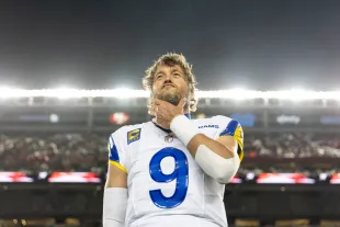 SANTA CLARA, CALIFORNIA - DECEMBER 12: Matthew Stafford #9 of the Los Angeles Rams reacts during the national anthem prior to an NFL Football game against the San Francisco 49ers at Levi's Stadium on December 12, 2024 in Santa Clara, California. (Photo by Michael Owens/Getty Images)