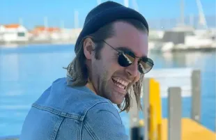 Waking World co-creator arrested following fatal incident involving partner.