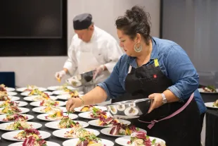 Ayesha Nurdjaja attends a dinner hosted by Ayesha Nurdjaja and Michael Symon as part of the Food Network New York City Wine & Food Festival presented by Capital One (Image via Getty).