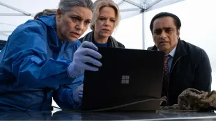 After a spine is dredged from Whitney Marsh, Jess James and Sunny Khan review the forensics with the pathologist at the scene, launching a new case. Image via PBS.