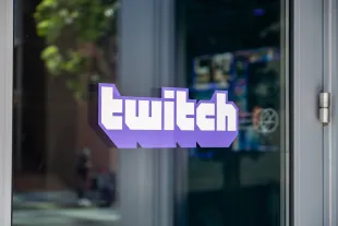 Sign with logo on facade at headquarters of streaming service Twitch in downtown San Francisco, California, May 20, 2025 (Image via Getty)