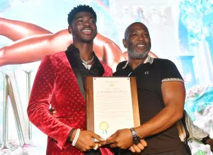 Lil Nas X poses with his father Robert Stafford at The Gathering Spot on October 20, 2021 in Atlanta, Georgia (Image via Getty)