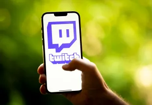 The Twitch logo is seen in this photo illustration on 22 August, 2023 in Warsaw, Poland. (Photo by Jaap Arriens/NurPhoto via Getty Images)