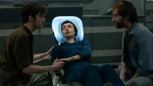 Alien: Earth Episode 4, Observation: Wendy (Sydney Chandler) is stabilized in Prodigy’s med bay as Hermit (Alex Lawther) and Arthur (David Rysdahl) look on. Image courtsey: FX and Hulu.