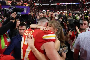 LAS VEGAS, NEVADA - FEBRUARY 11: Travis Kelce #87 of the Kansas City Chiefs hugs Taylor Swift after defeating the San Francisco 49ers 25-22 during Super Bowl LVIII at Allegiant Stadium on February 11, 2024 in Las Vegas, Nevada. (Photo by Ezra Shaw/Getty Images)