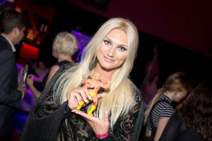 LOS ANGELES, CALIFORNIA - JUNE 21:  Actress Brooke Hogan poses with a Hulk Hogan figurine at the Premiere Of Netflix's "GLOW" After Party at Florentine Gardens on June 21, 2017 in Los Angeles, California.  (Photo by Greg Doherty/Getty Images)