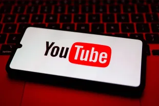 YouTube logo is displayed on a mobile phone screen for illustration photo. Krakow, Poland on February 9, 2023.  (Photo by Beata Zawrzel/NurPhoto via Getty Images)