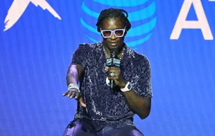 ATLANTA, GEORGIA - NOVEMBER 13:   Rapper Young Thug speaks onstage at the 2021 REVOLT Summit at 787 Windsor on November 13, 2021 in Atlanta, Georgia. (Photo by Paras Griffin/Getty Images)