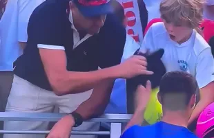 A man stole Kamil Majchrzak's hat from a kid's hands. (Photo: X/@Bubblebathgirl)