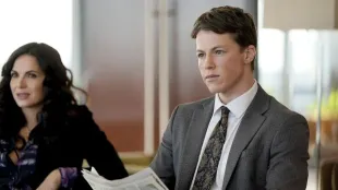 Conference-room stare-down in The Rainmaker Episode 3, as the legal team weighs the $80M settlement play and the search for Jackie tightens. (Image via USA Networks)