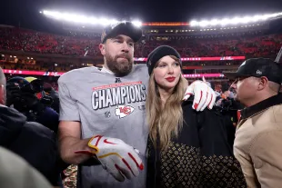 KANSAS CITY, MISSOURI - JANUARY 26: Taylor Swift celebrates with Travis Kelce #87 of the Kansas City Chiefs after defeating the Buffalo Bills 32-29 in the AFC Championship Game at GEHA Field at Arrowhead Stadium on January 26, 2025 in Kansas City, Missouri.  (Photo by Jamie Squire/Getty Images)