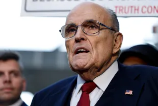 Rudy Giuliani speaks with reporters outside of the E. Barrett Prettyman U.S. District Courthouse after a verdict was reached in his defamation jury trial on December 15, 2023 in Washington, DC. A jury has ordered Giuliani to pay $148 million in damages to Fulton County election workers Ruby Freeman and Shaye Moss (Image via Getty)