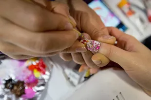 TOKYO, JAPAN - FEBRUARY 27:  A woman has her choosen anime character painted onto her fingernails at Ita Color's Yellow nail salon on February 27, 2014 in Akihabara district, Tokyo, Japan. Clients are able to bring in any image they desire and have them painted onto their fingernails some even in 3-D.  Japanese Anime characters are currently the most popular and a full set of nails can take as long as three hours to complete, depending on how complex the design. Over the past five years the nail-care and nail art industry in Japan has been booming with an estimated market size of over 200billion yen.  (Photo by Chris McGrath/Getty Images)