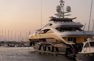 A representational image of a yacht (Image via Unsplash/Eugene Chystiakov)
