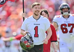MrBeast runs on to the field prior to a game between the Tampa Bay Buccaneers and the Atlanta Falcons at Raymond James Stadium on October 22, 2023 in Tampa, Florida. (Photo by Julio Aguilar/Getty Images)