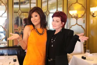Big Brother host Julie Chen with Sharon Osbourne (Image via Getty)