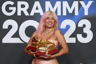 Karol G poses with awards during The 24th Annual Latin Grammy Awards on November 16, 2023 in Seville, Spain (Image via Getty)
