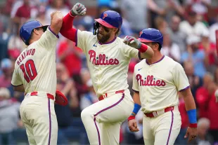 PHILADELPHIA, PENNSYLVANIA - MAY 6: Bryce Harper #3 of the Philadelphia Phillies celebrates with J.T. Realmuto #10 after hitting a three run home run against the San Francisco Giants in the bottom of the fifth inning at Citizens Bank Park on May 6, 2024 in Philadelphia, Pennsylvania. (Photo by Mitchell Leff/Getty Images)