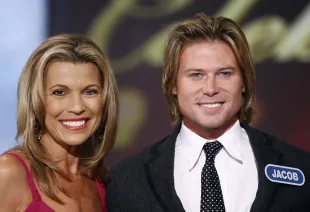 Vanna White and Jacob Young at the taping of the "Wheel of Fortune" 25th Anniversary People Magazine Celebrity Week (image via Getty).