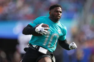 ORLANDO, FLORIDA - FEBRUARY 04: Tyreek Hill #10 of the Miami Dolphins and AFC runs with the ball during the first half of the 2024 NFL Pro Bowl Games at Camping World Stadium on February 04, 2024 in Orlando, Florida. (Photo by Mike Ehrmann/Getty Images)