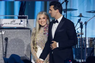 Charlie Kirk and and his wife Erika Lane Frantzve (Image via Getty)