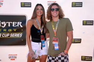 Angela Rummans and Tyler Crispen attend the driver's meeting prior to the Monster Energy NASCAR Cup Series Auto Club 400 at Auto Club Speedway (Image via Getty).