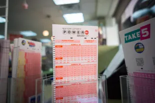Powerball tickets on a convenience store shelf to enter for an estimated $1.3 billion jackpot, seen on Monday, January 11, 2016. The jackpot has rolled over 18 times with no winner with the next drawing Wednesday. (�� Richard B. Levine) (Photo by Richard Levine/Corbis via Getty Images)